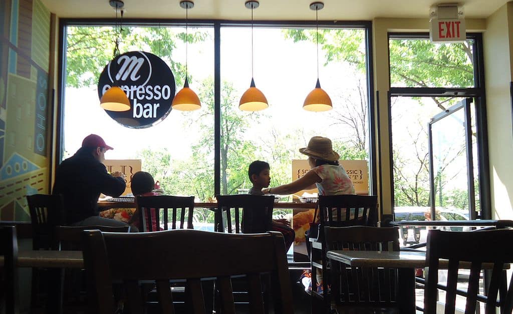 family restaurant enjoying coffee