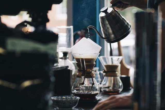 Pouring coffee at a café