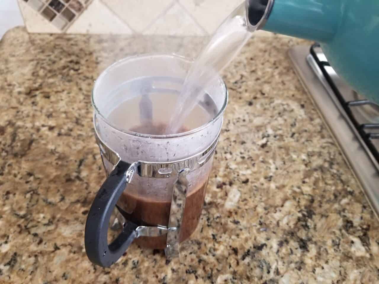 Pouring filtered water in French Press