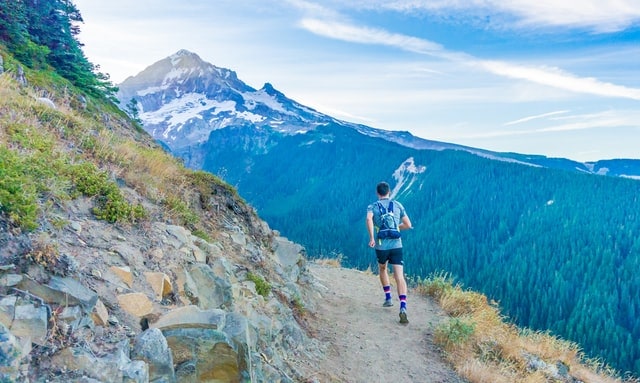 Person running on a hiking trail