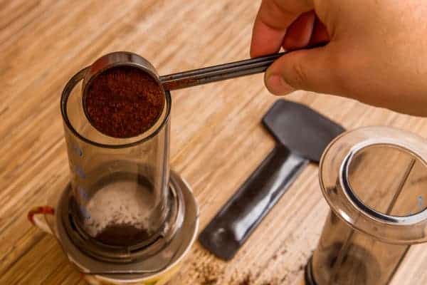 Pouring grounds in an aeropress