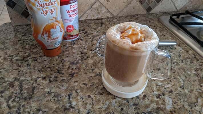 caramel latte macchiato coffee with whipped cream