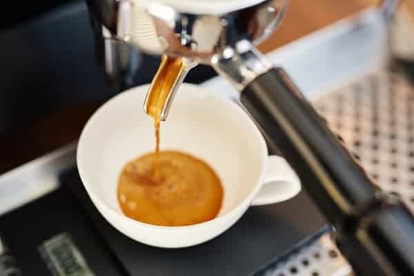 Pouring espresso into a cup